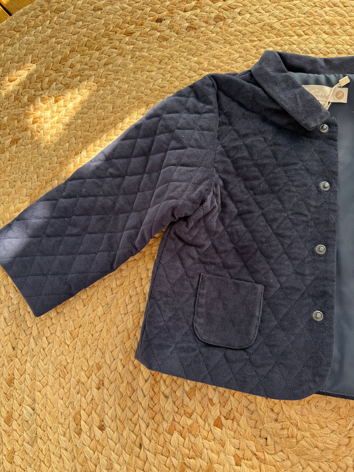 Veste matelassée en velours bleu marine